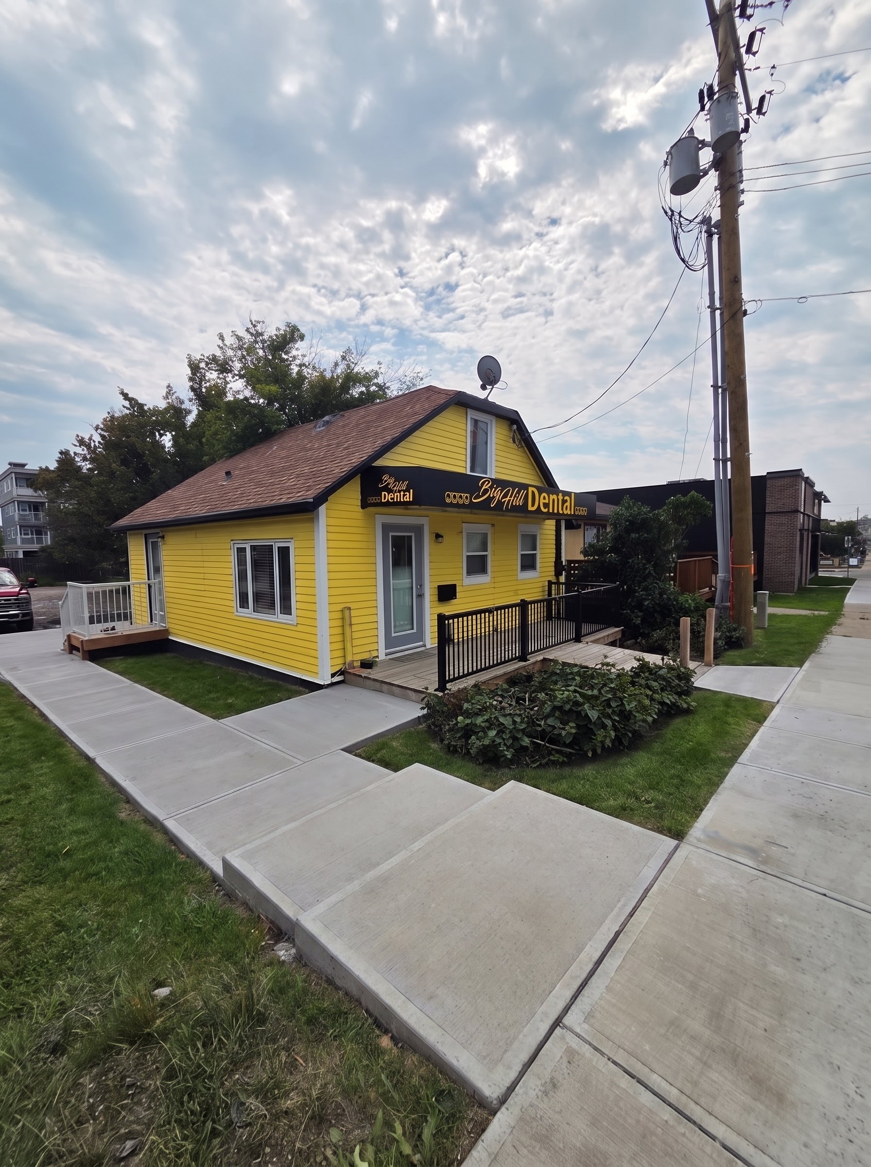 The front entrance and deck at Big Hill Dental in Cochrane