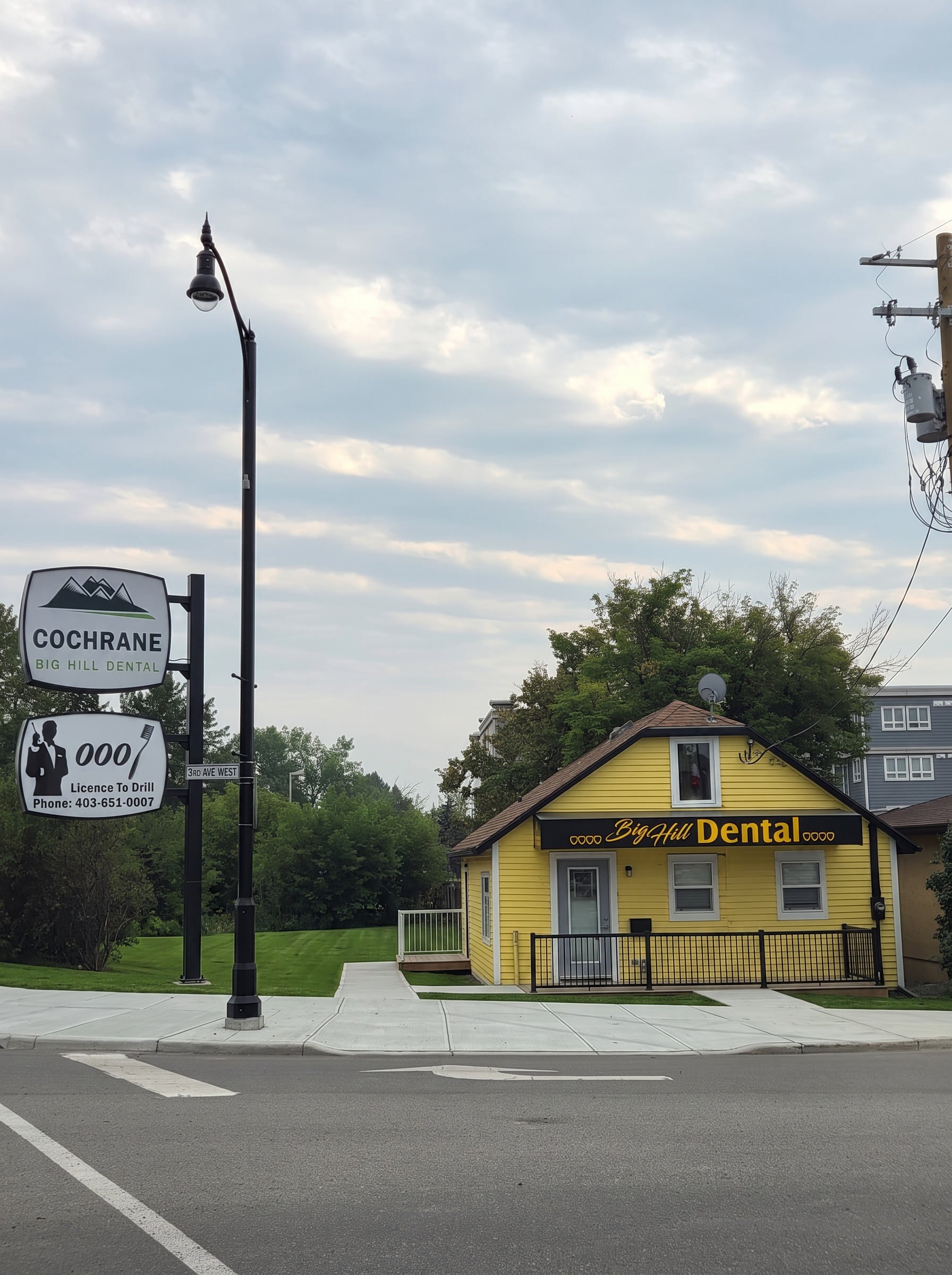 The Big Hill Dental roadside sign at 3rd Avenue West, Cochrane